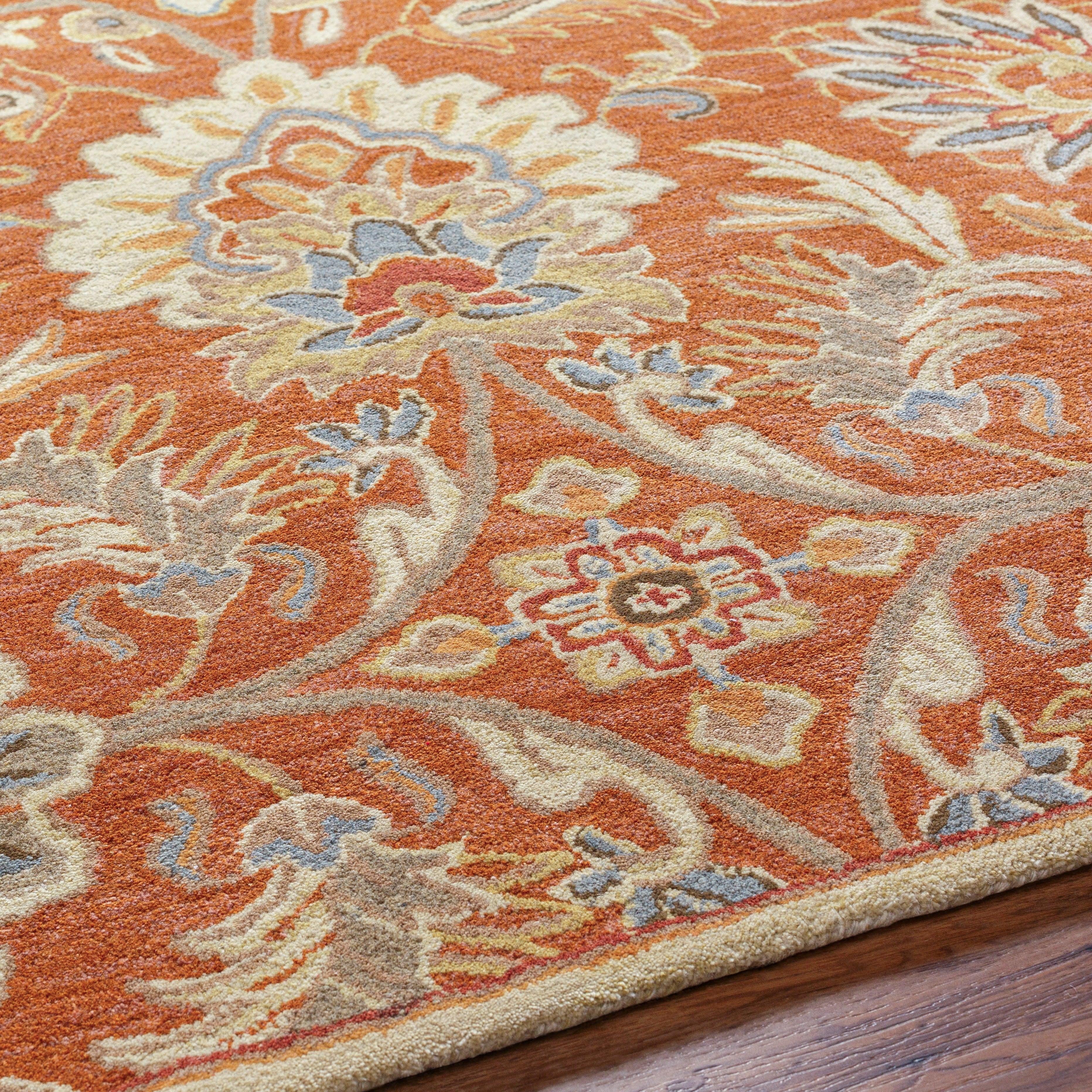 Mediterranean Cider hand-tufted wool rug with burnt orange floral patterns