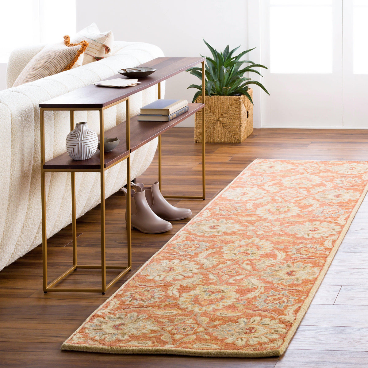 Mediterranean Cider hand-tufted wool runner rug with burnt orange floral pattern on hardwood floor