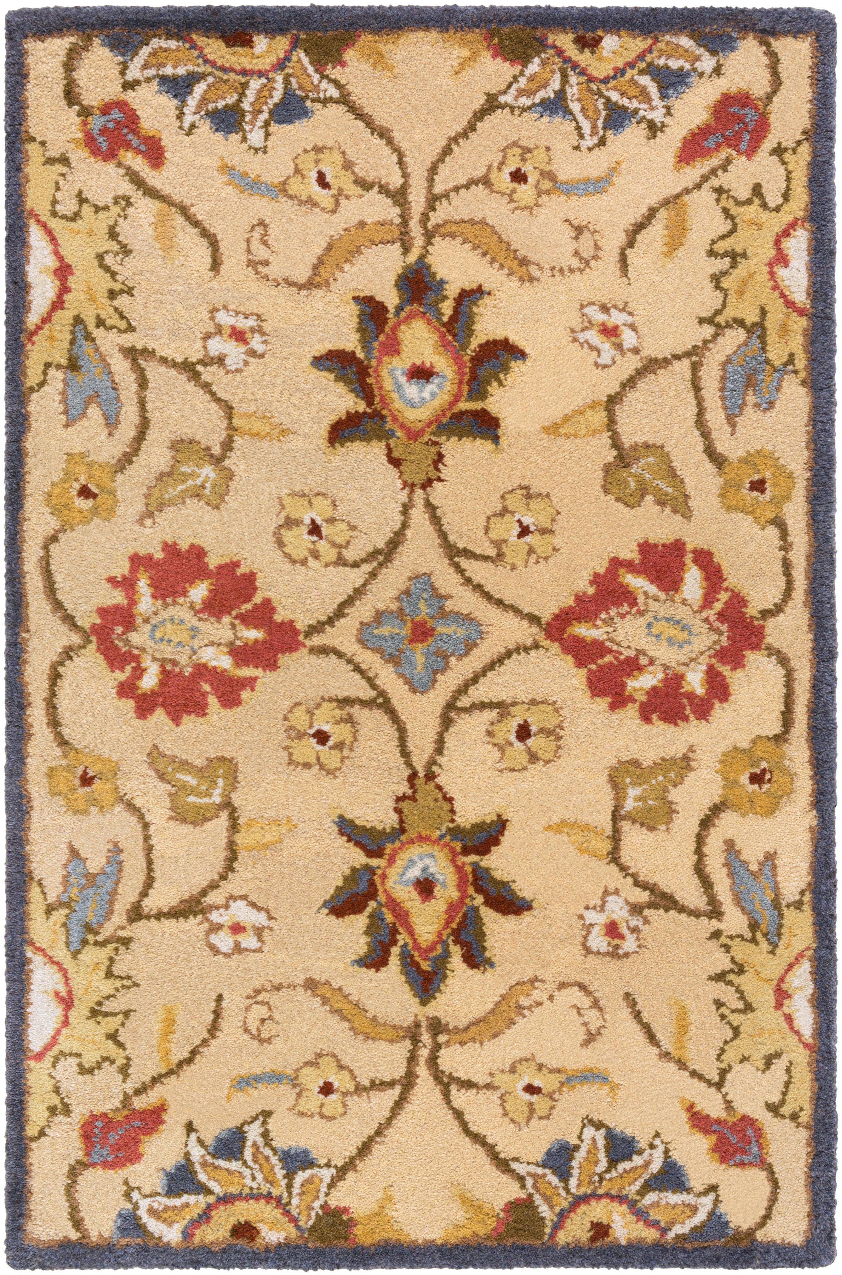 Mediterranean wool rug with floral patterns in red, tan, blue, and olive.