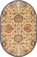 Oval Mediterranean hand-tufted wool rug with red, blue, and olive floral patterns on a tan background.