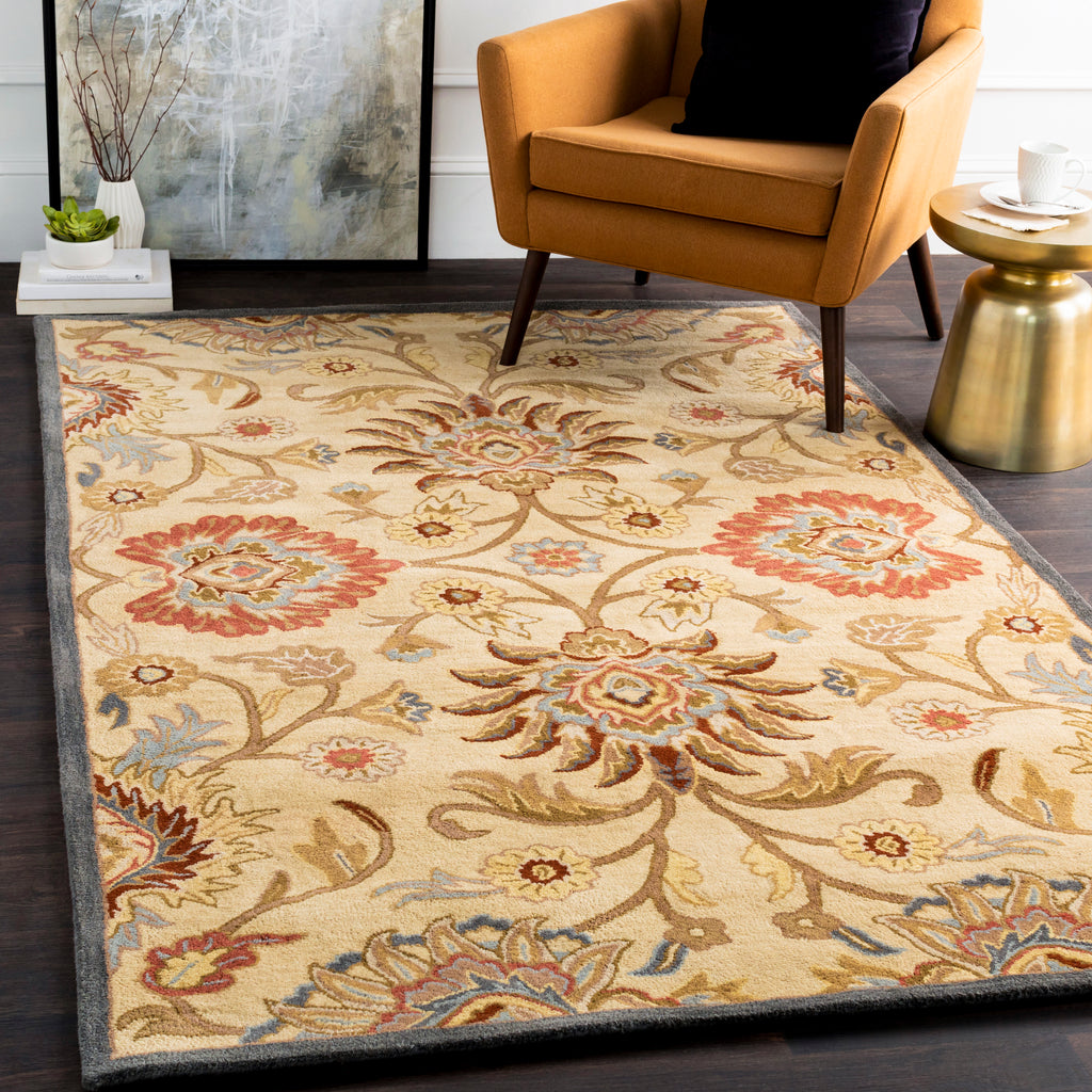 Mediterranean Multi Hand-Tufted wool rug with floral patterns in red, tan, and blue.