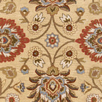 Mediterranean hand-tufted wool rug with red, blue, and olive floral patterns on a tan background.
