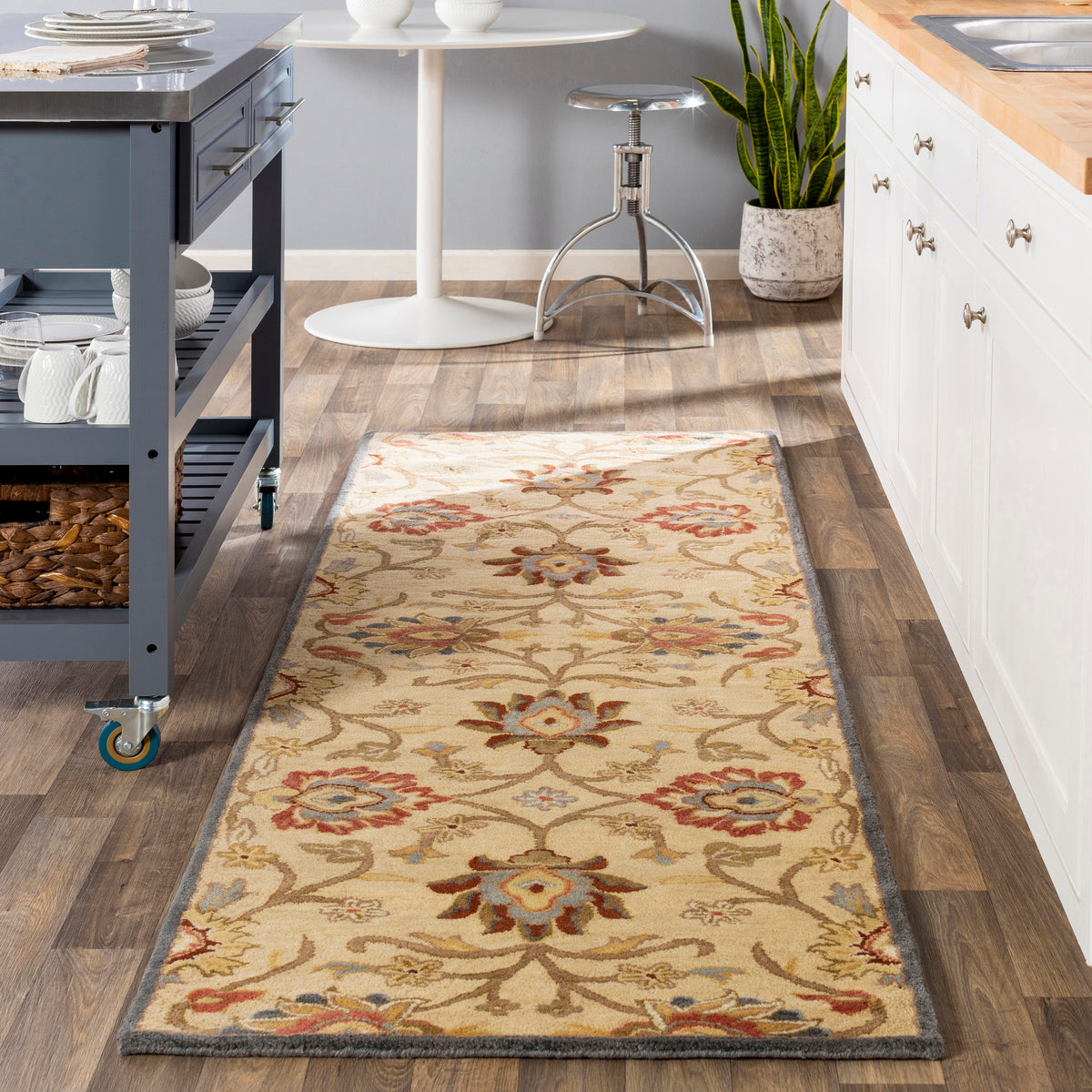 Mediterranean Multi Hand-Tufted wool runner rug with floral patterns in a kitchen.