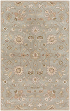 Giardino Stone hand-tufted wool rug with a floral pattern in blue-grey, beige, and brown.