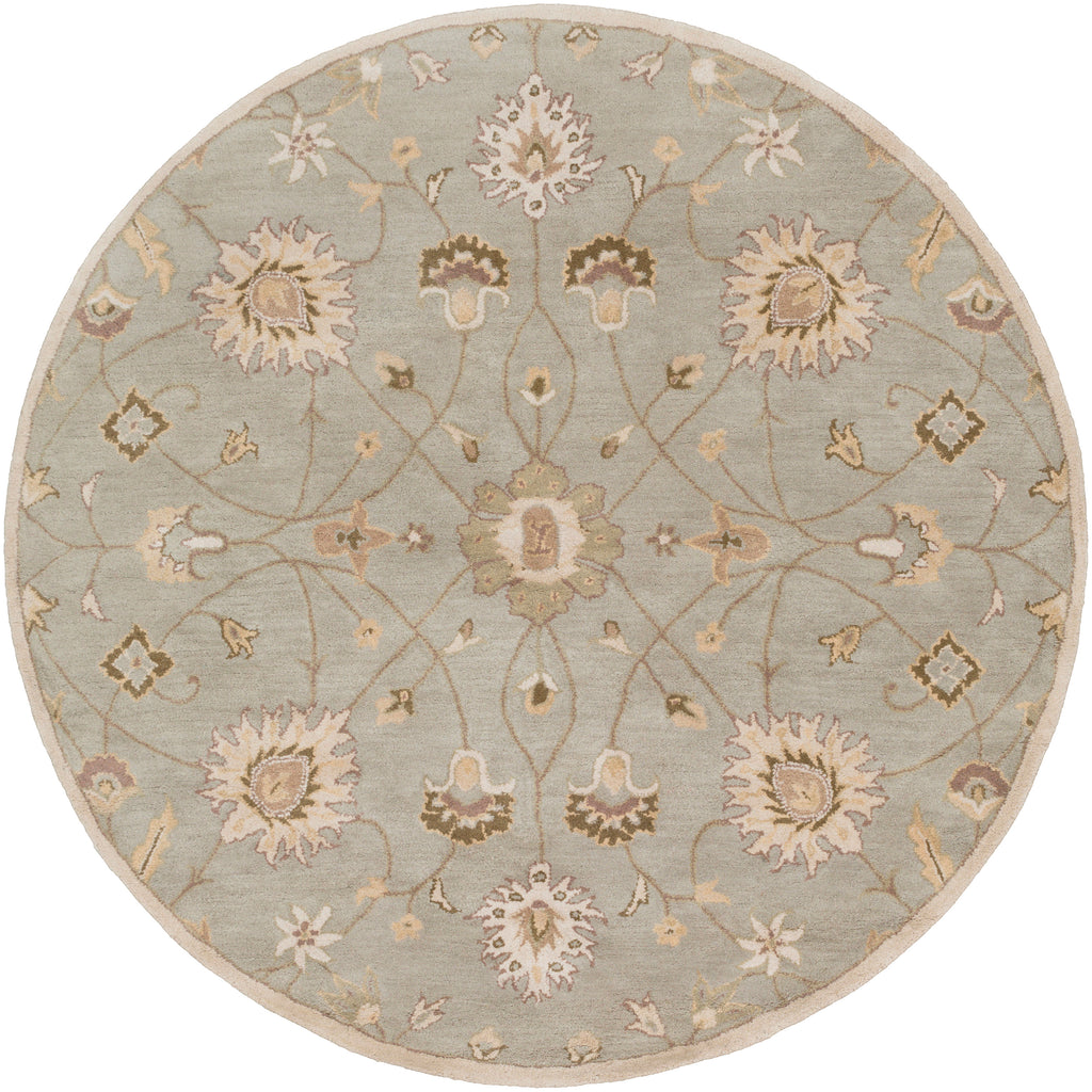 Giardino round wool rug in blue-grey with a beige floral pattern.