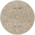 Giardino round wool rug in blue-grey with a beige floral pattern.