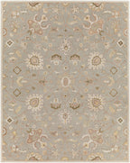 Giardino Stone hand-tufted wool rug with a blue-grey floral pattern and beige accents.