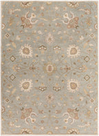 Giardino Stone hand-tufted wool rug with a blue-grey background and beige floral pattern.