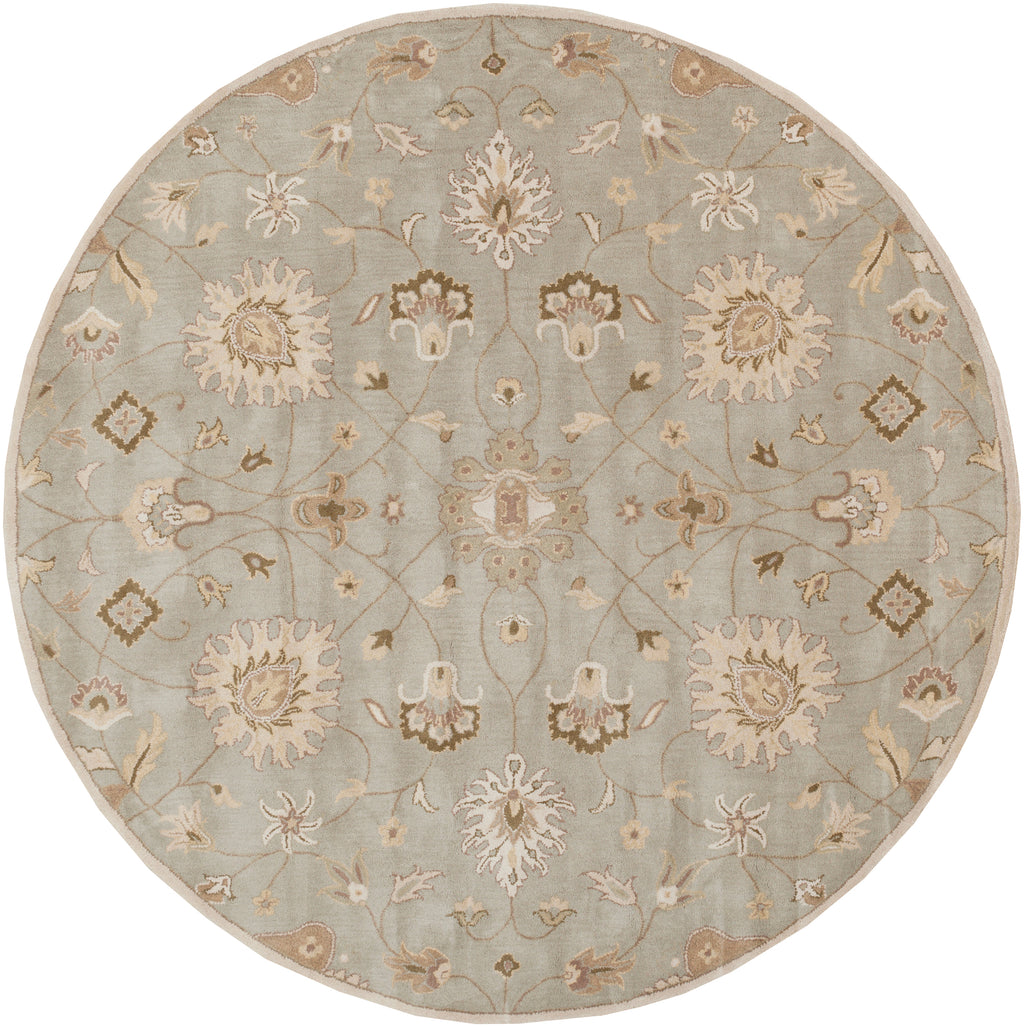 Round Giardino Stone hand-tufted wool rug with a blue-grey floral pattern.