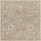 Giardino Stone hand-tufted wool rug with a floral pattern in blue-grey, beige, and brown.