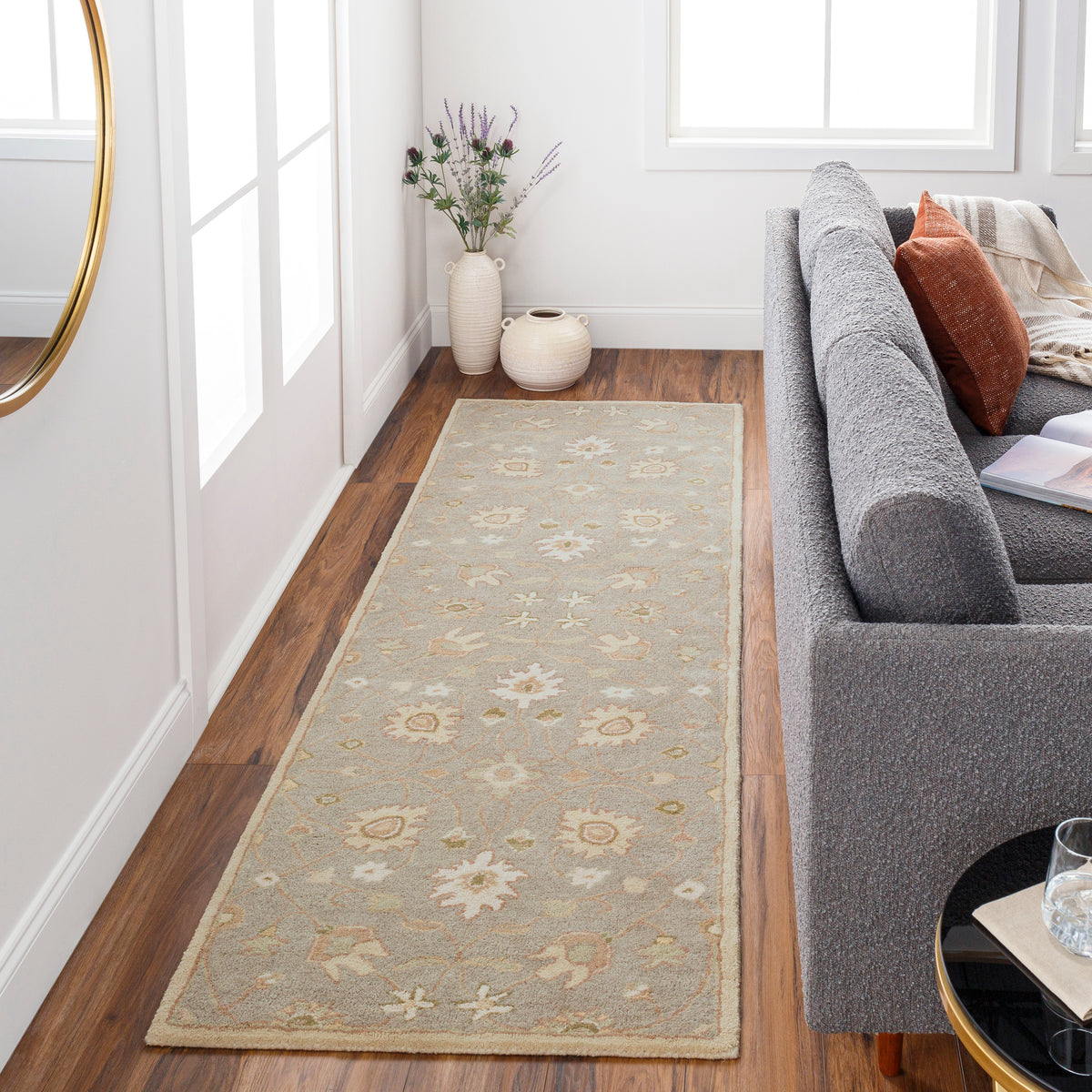 Giardino Stone blue-grey floral hand-tufted wool runner rug in a living room.