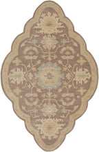 Julian Sand hand-tufted wool rug featuring a scalloped oval shape and traditional floral motifs.