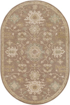 Julian Sand hand-tufted oval wool rug with traditional floral patterns in warm beige and sage green.
