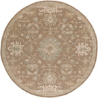 Julian Sand round hand-tufted wool rug with traditional floral patterns in beige and sage green.