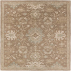 Julian Sand hand-tufted wool rug with a square traditional floral pattern in warm beige and sage.