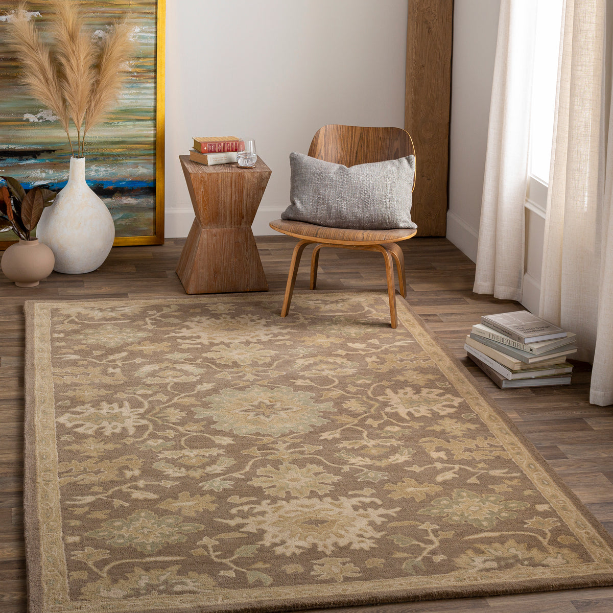 Julian Sand hand-tufted wool rug with a warm sand and sage floral pattern in a living room.