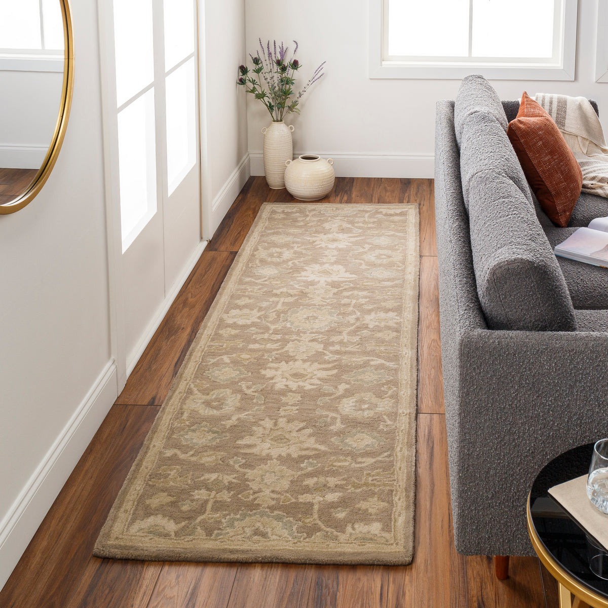 Julian Sand hand-tufted wool runner rug with a floral pattern in a hallway.