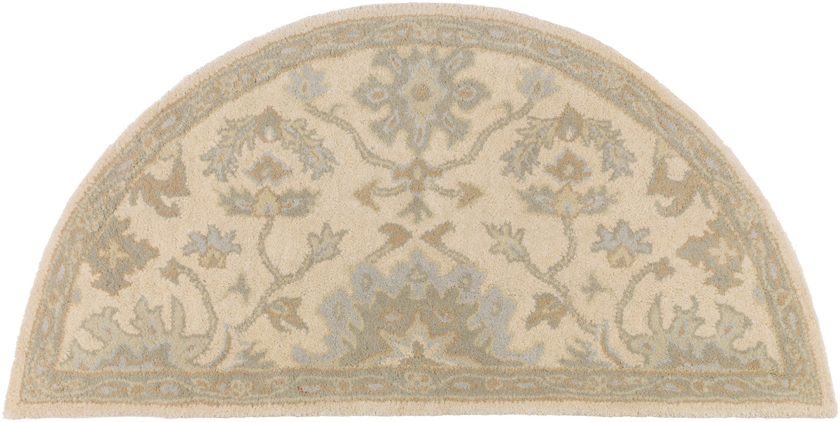 Julian half-circle wool rug in natural beige with light green and grey floral patterns.