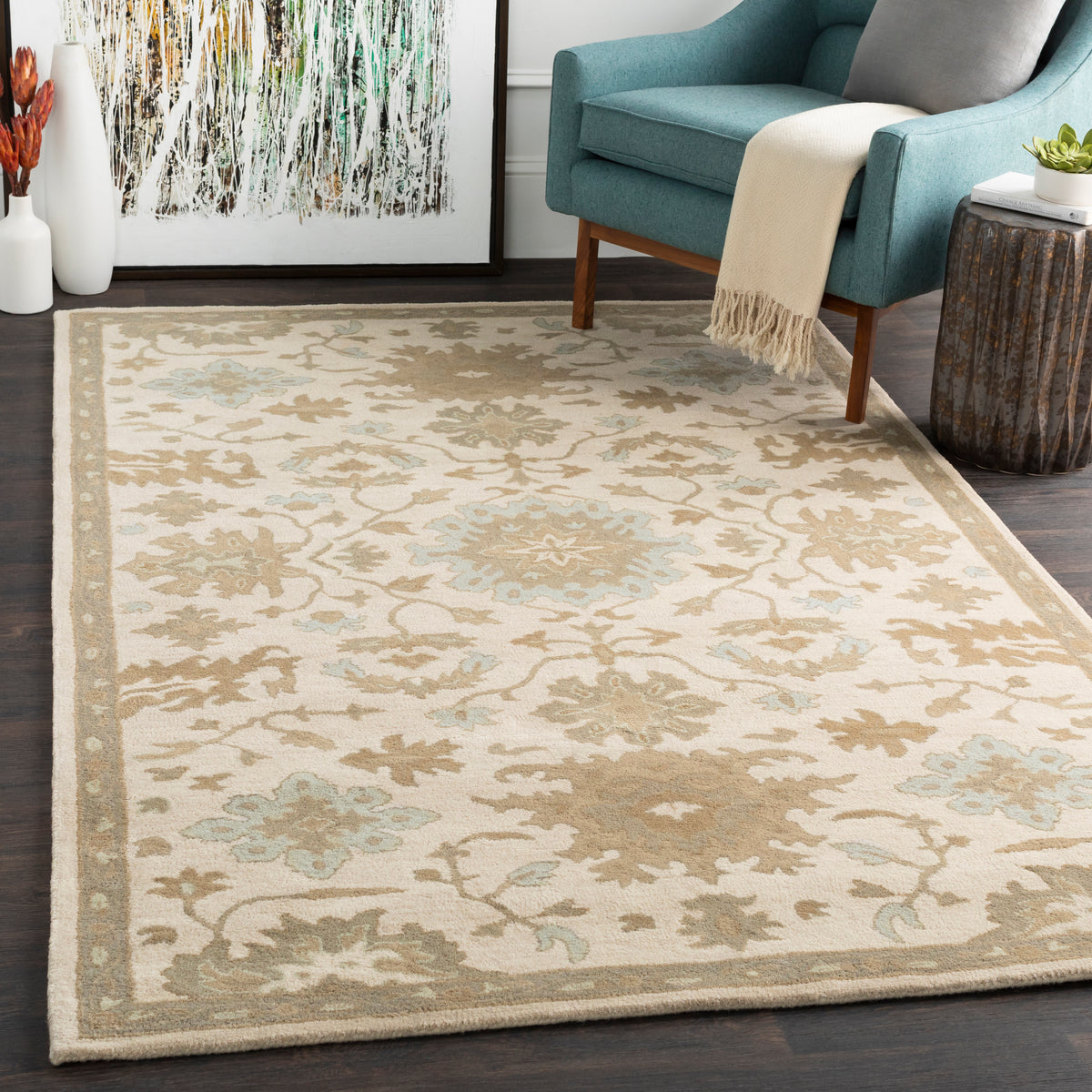 Julian Natural Hand-Tufted wool rug with beige and light blue floral patterns in a living room.
