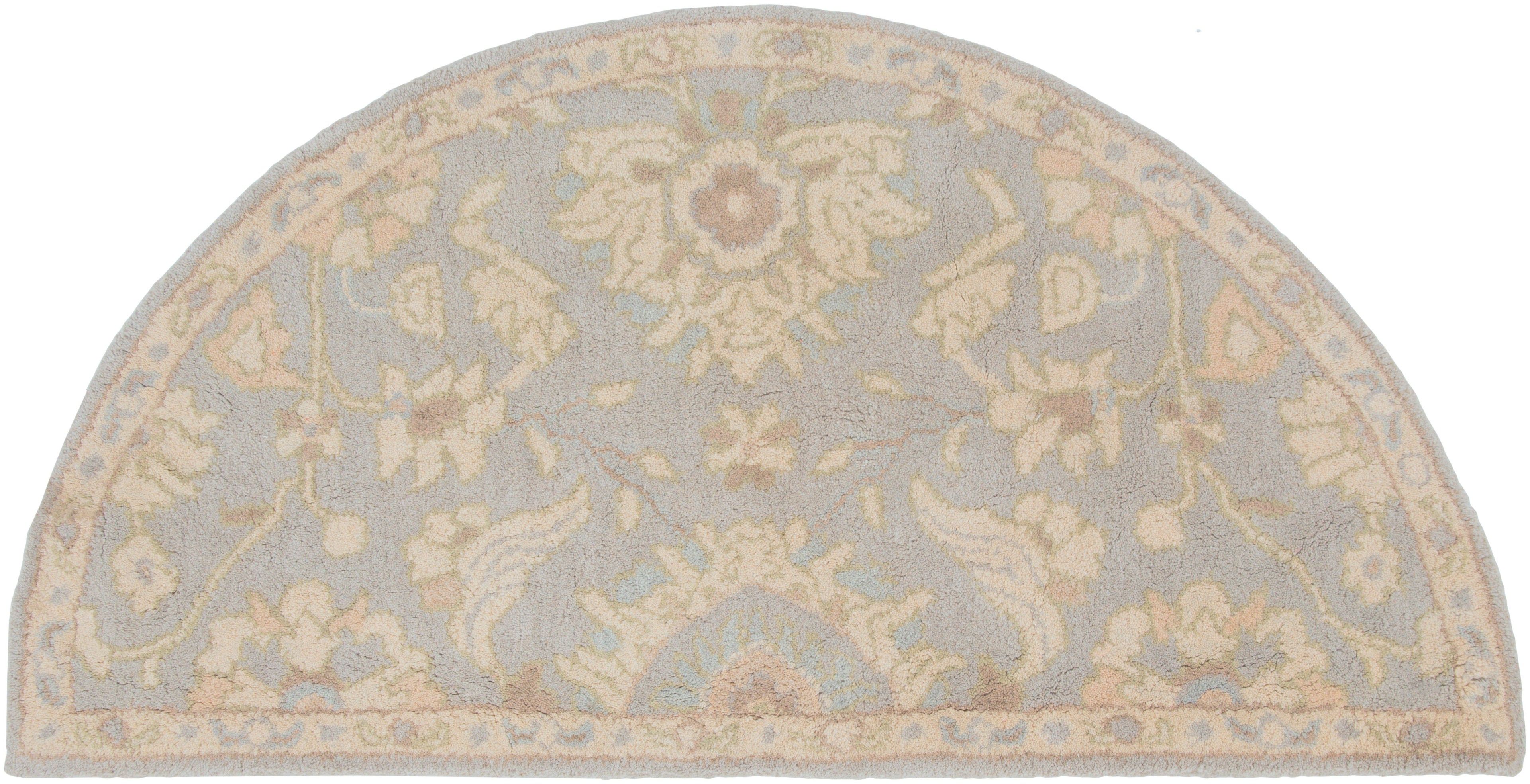 Julian Arctic half-round hand-tufted wool rug with light blue and beige floral patterns.