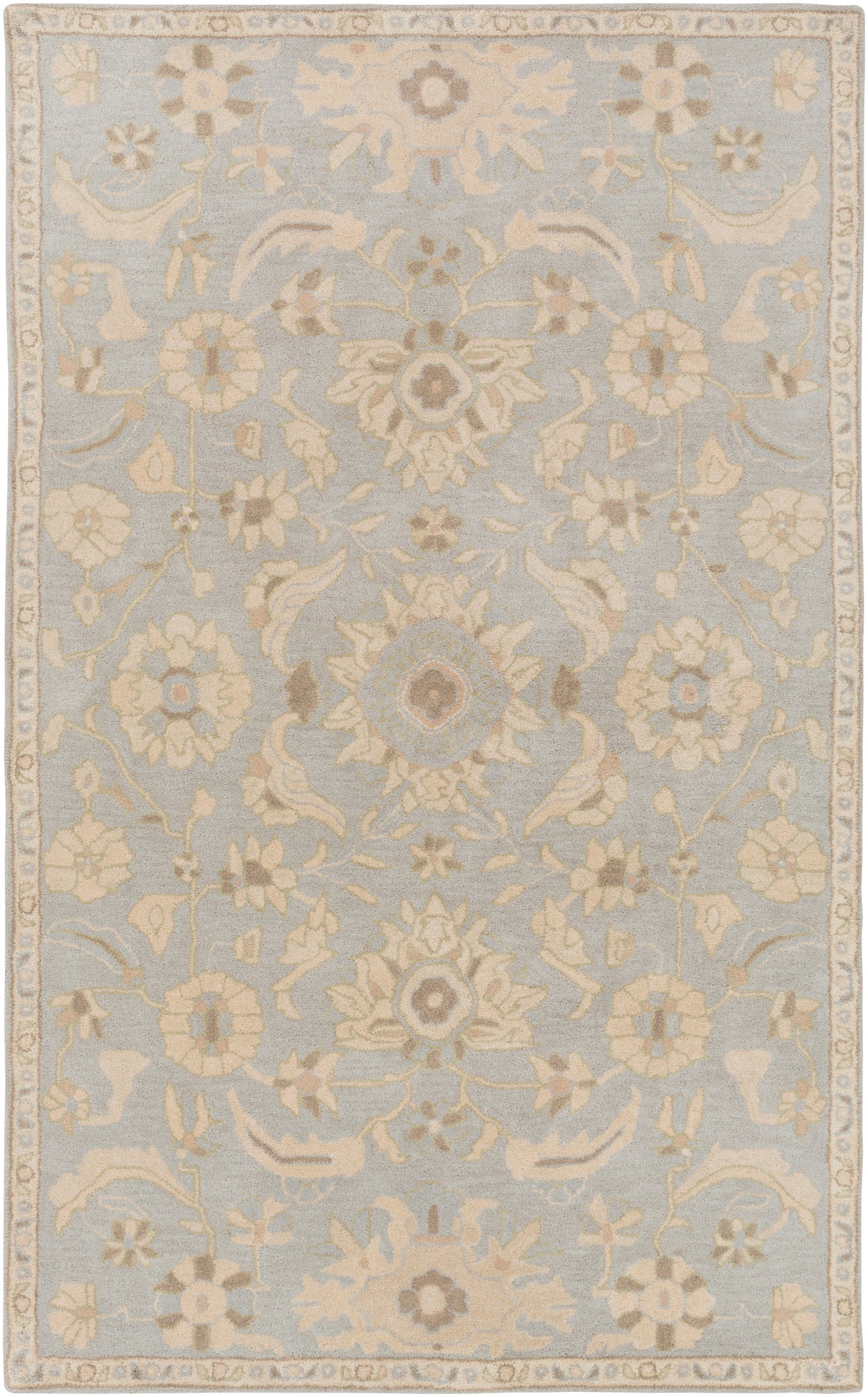 Julian Arctic hand-tufted wool rug featuring a light blue background with beige floral patterns.