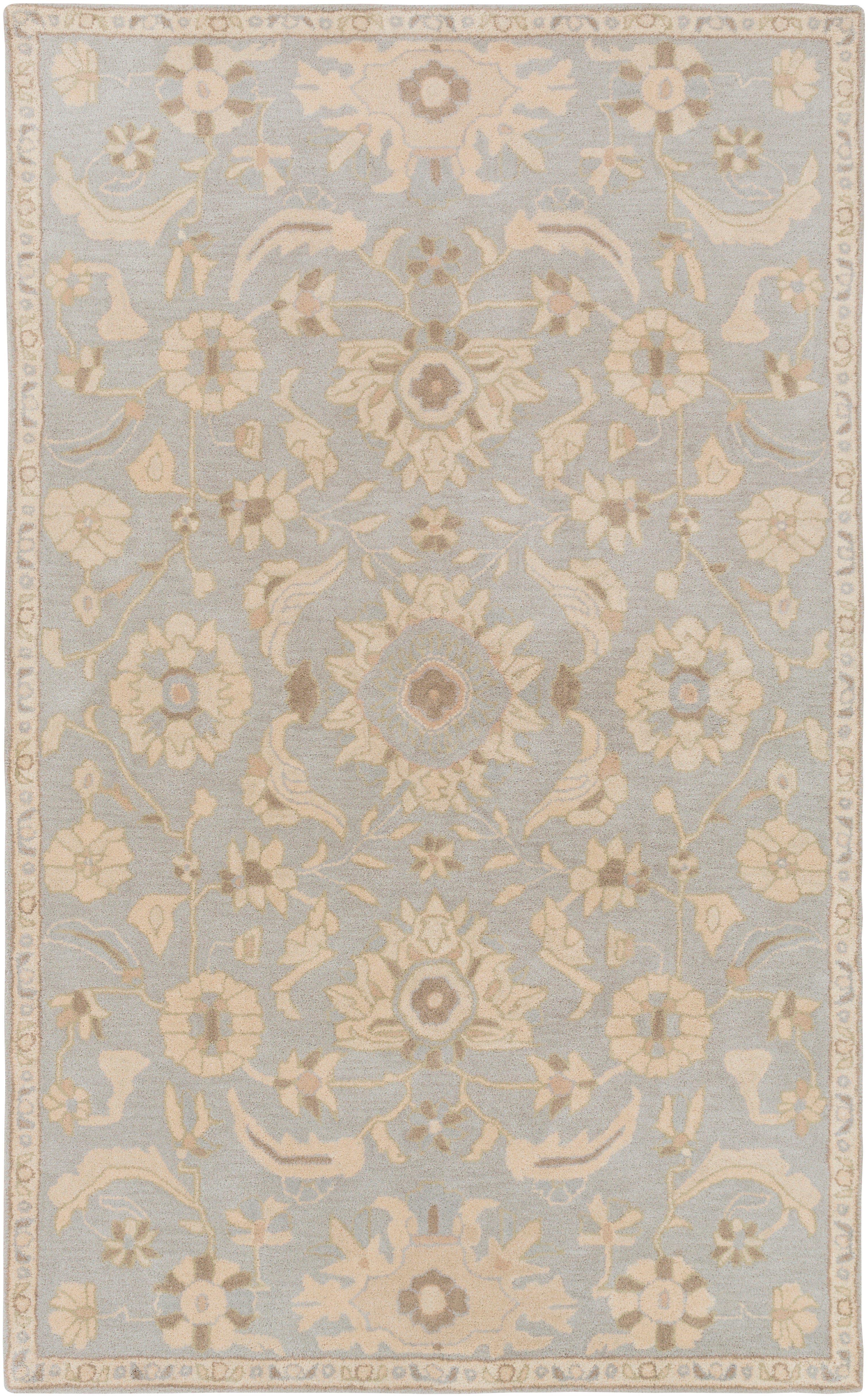 Julian Arctic hand-tufted wool rug featuring a light blue background with beige floral patterns.