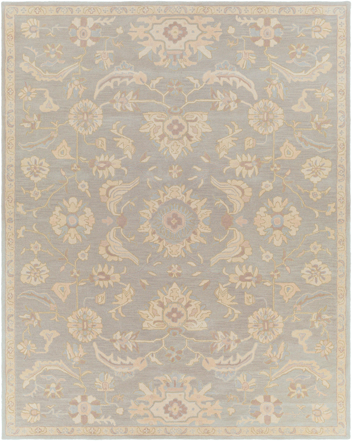 Julian Arctic hand-tufted wool rug featuring a muted blue and beige floral pattern.