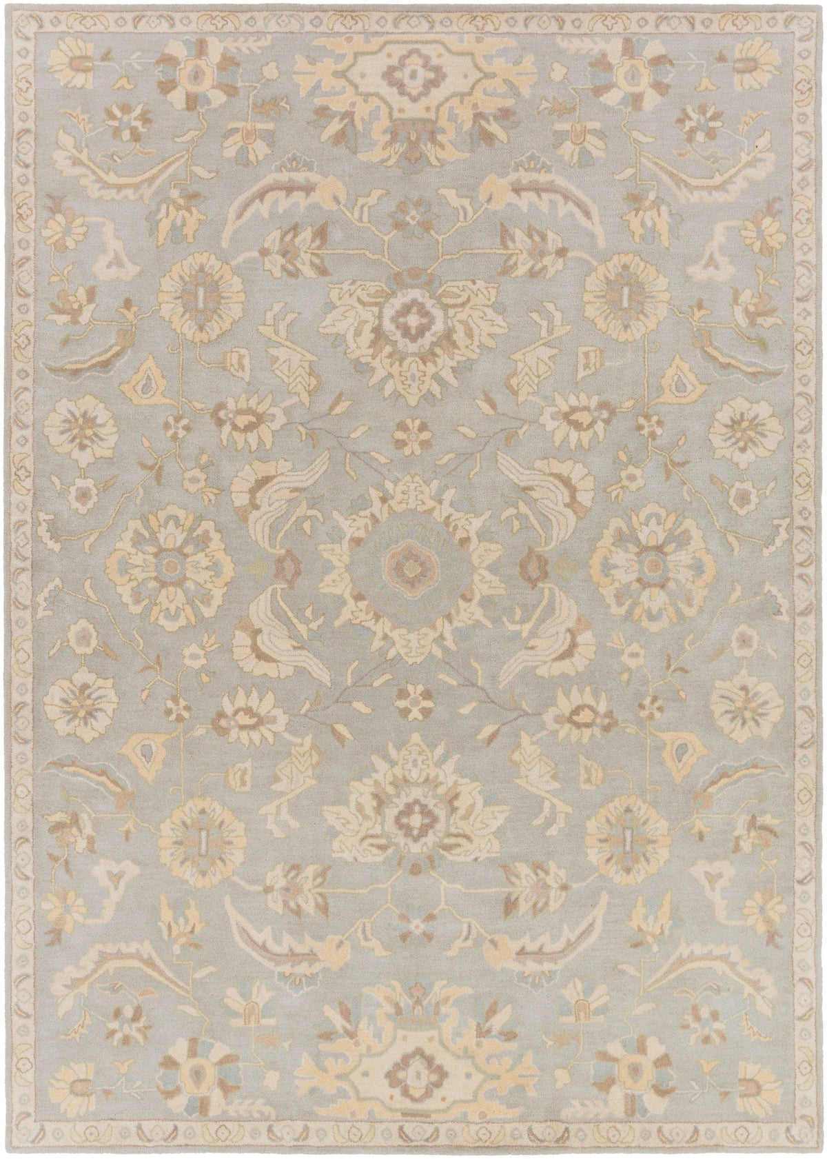 Julian Arctic hand-tufted wool rug featuring a light blue field with beige floral patterns.