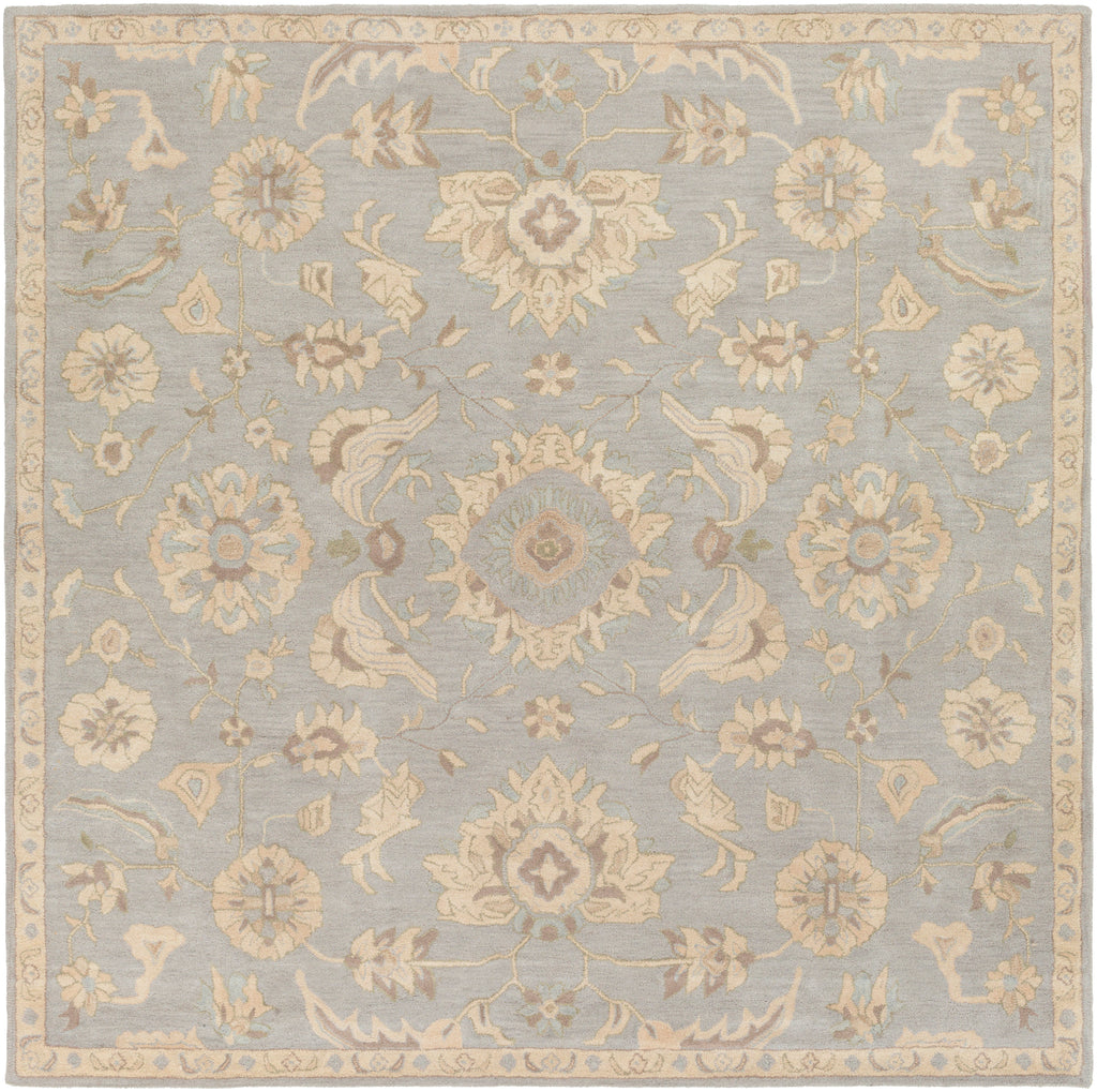 Julian Arctic hand-tufted square wool rug with a light blue and beige floral pattern.