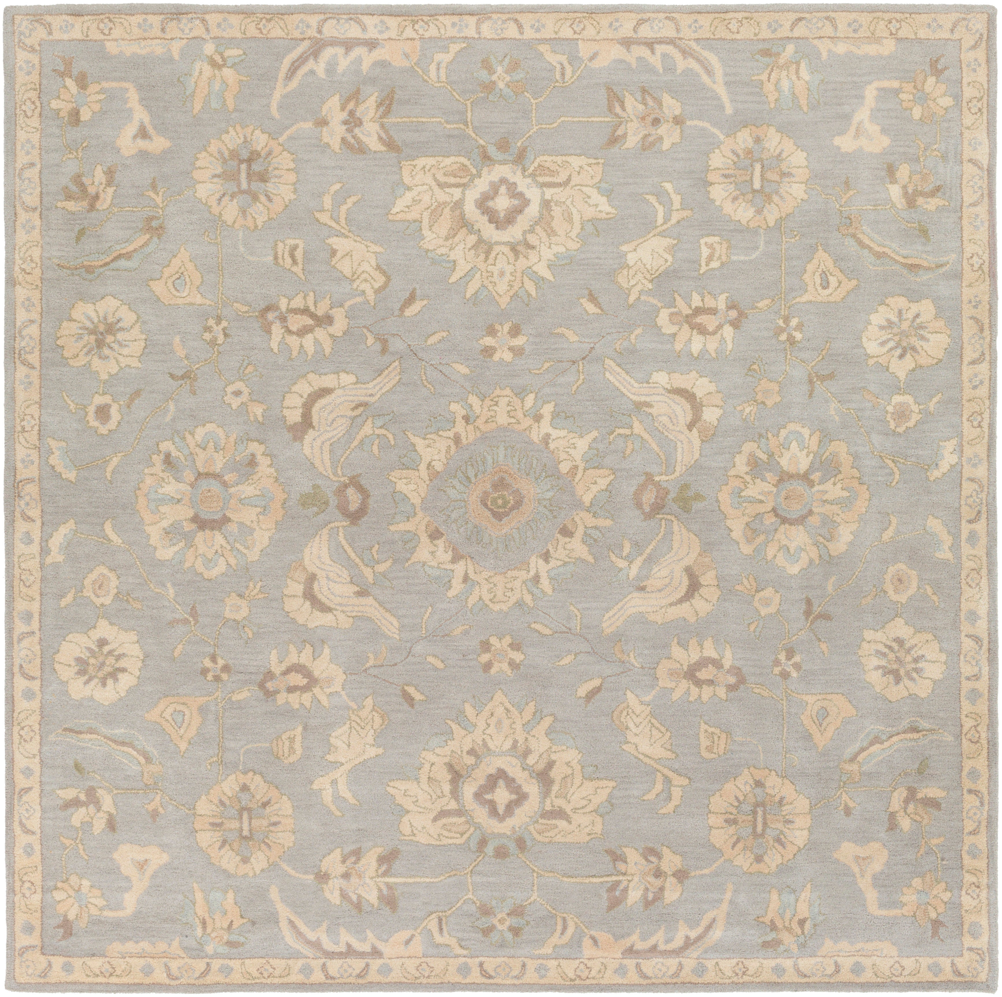 Julian Arctic hand-tufted square wool rug with a light blue and beige floral pattern.