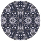 Round hand-tufted wool rug with intricate floral patterns in charcoal, slate, and denim.