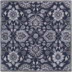 Mediterranean Ocean hand-tufted wool rug featuring a floral pattern in charcoal, slate, and denim.