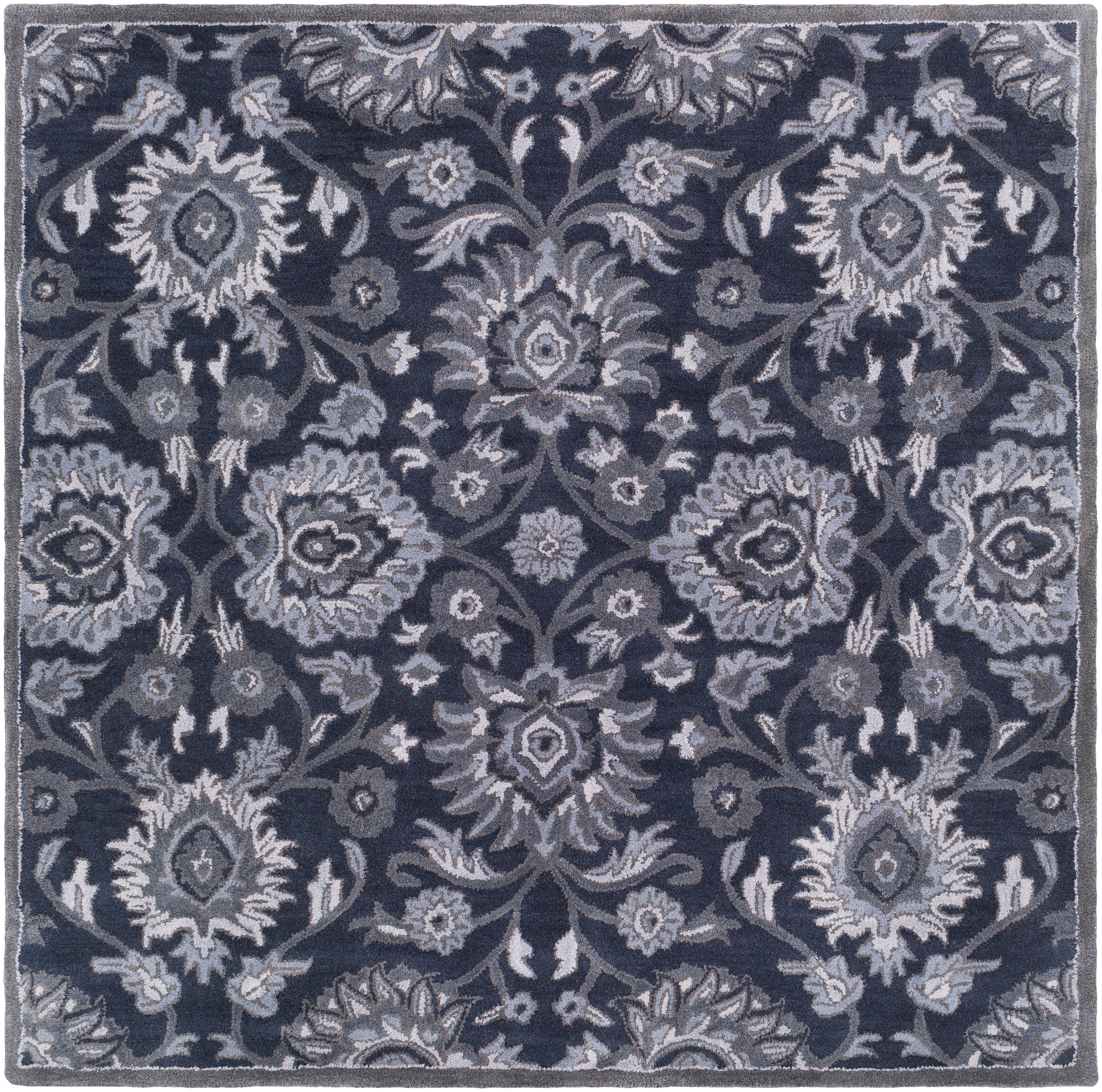 Mediterranean Ocean hand-tufted wool rug featuring a floral pattern in charcoal, slate, and denim.