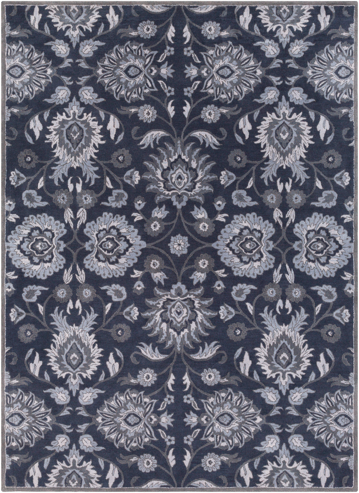 Mediterranean Ocean hand-tufted wool rug featuring a floral pattern in charcoal, slate, and denim.