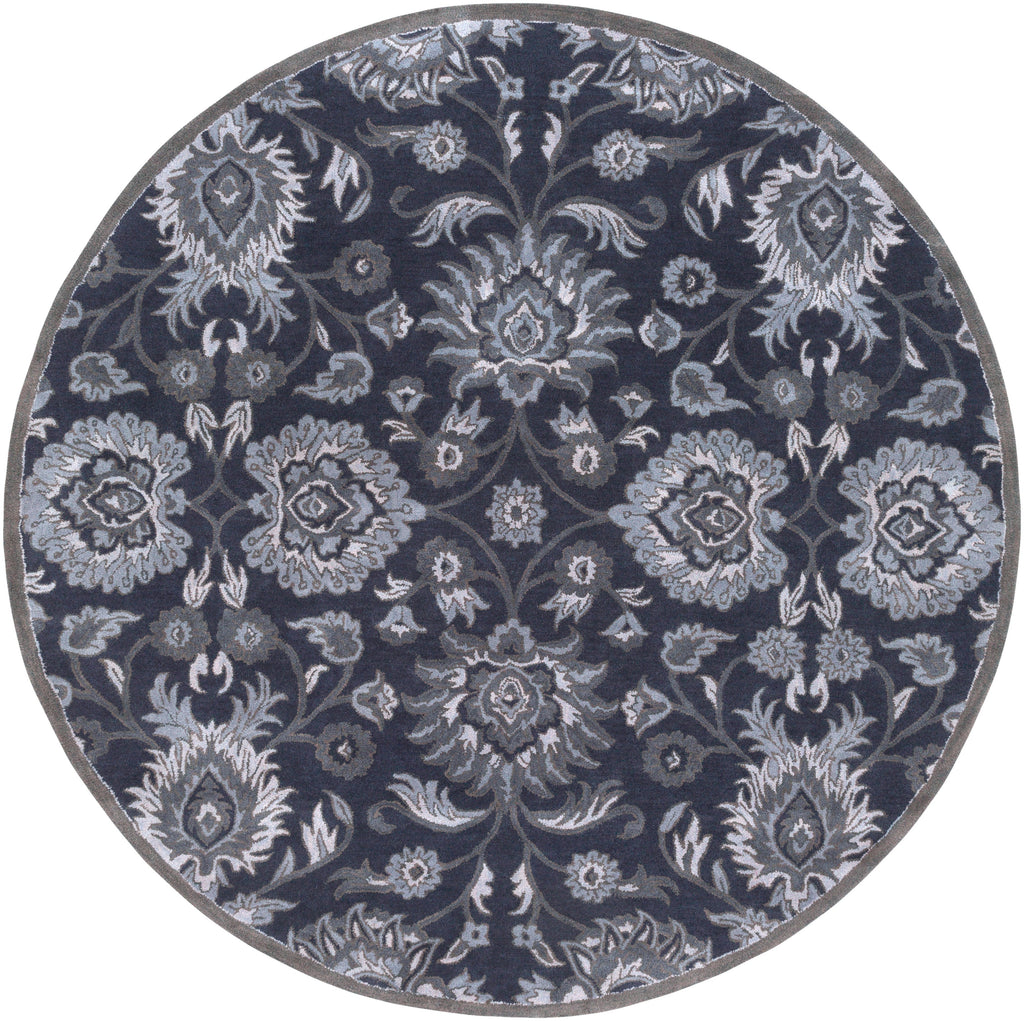 Round Mediterranean Ocean hand-tufted wool rug with charcoal, slate, and denim floral patterns.