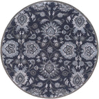 Round Mediterranean Ocean hand-tufted wool rug with charcoal, slate, and denim floral patterns.