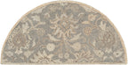 Half-round Mediterranean Seal hand-tufted wool rug with grey, taupe, and ivory floral patterns.