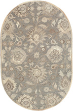 Oval Mediterranean Seal wool rug with grey, taupe, and ivory floral patterns.
