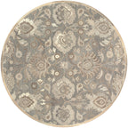 Round Mediterranean Seal hand-tufted wool rug with grey, taupe, and ivory floral patterns.