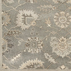 Rubicon Oyster hand-tufted wool rug with floral patterns in grey, beige, and ivory.