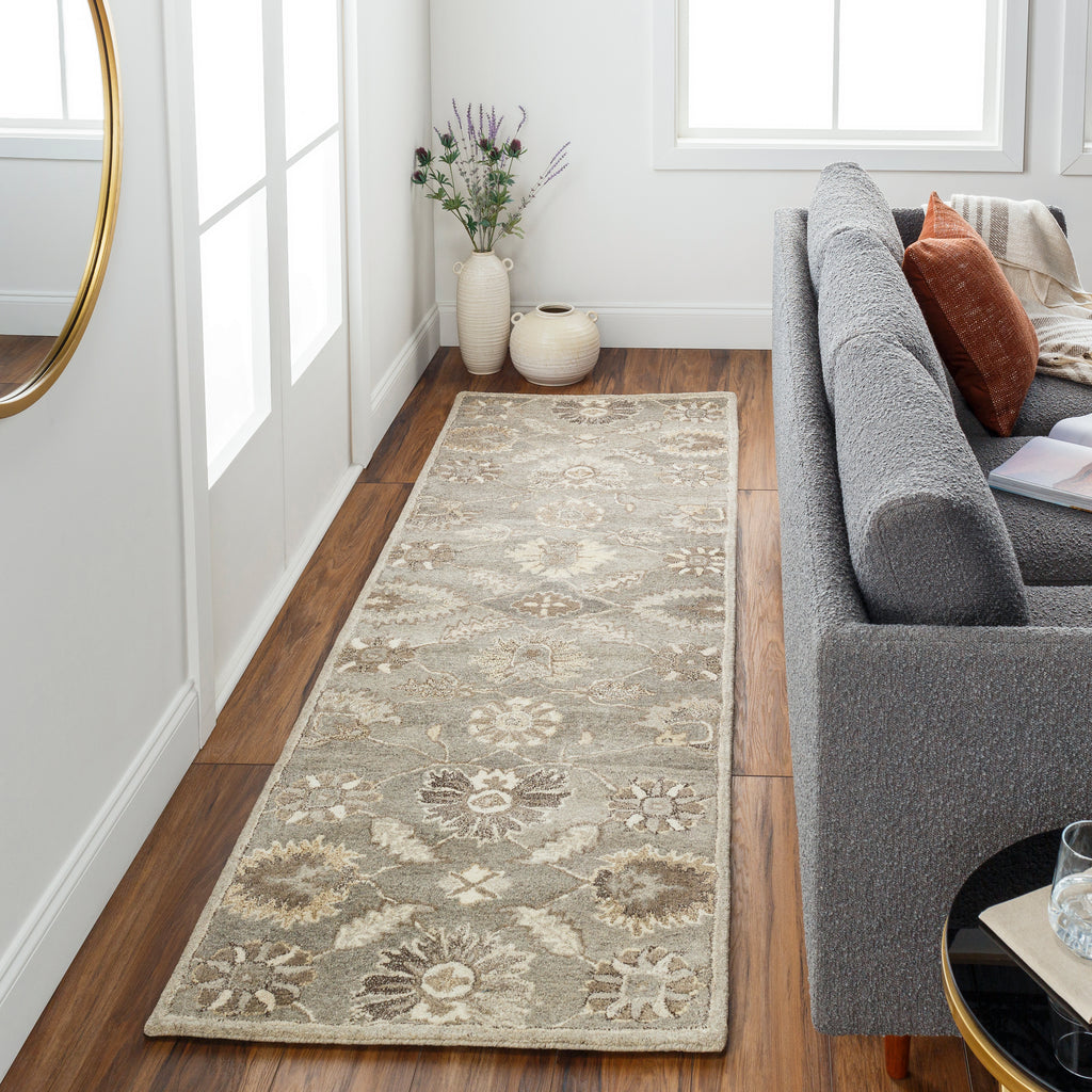 Rubicon Oyster hand-tufted wool runner rug with floral patterns in a living room.