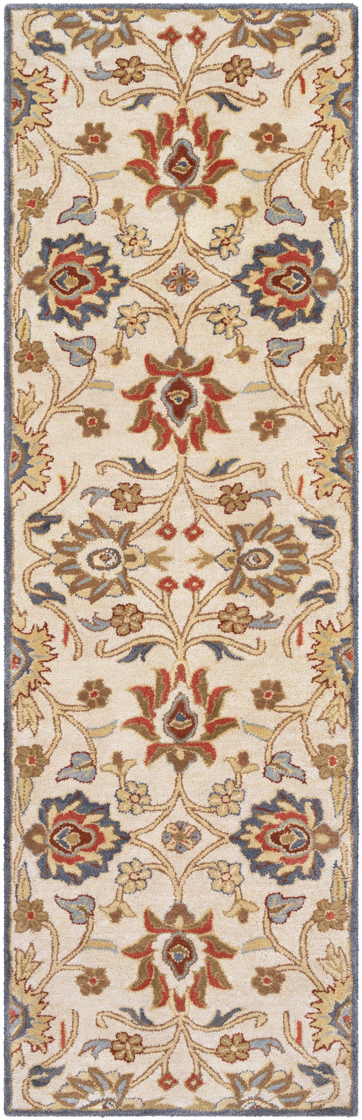 Mediterranean Fiesta hand-tufted wool runner rug with a floral pattern in red, blue, and beige.