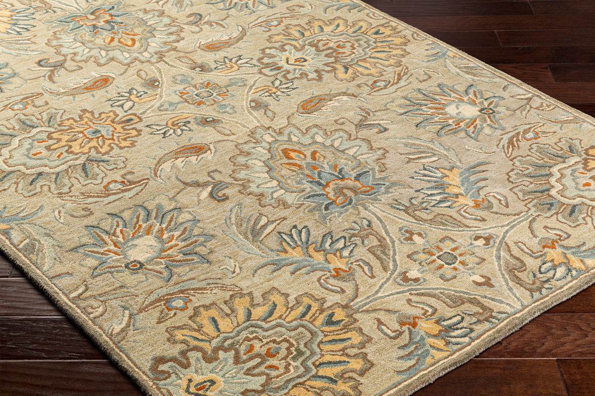 Mediterranean Pewter hand-tufted wool rug with gray, brick red, and slate floral patterns on dark wood floor.