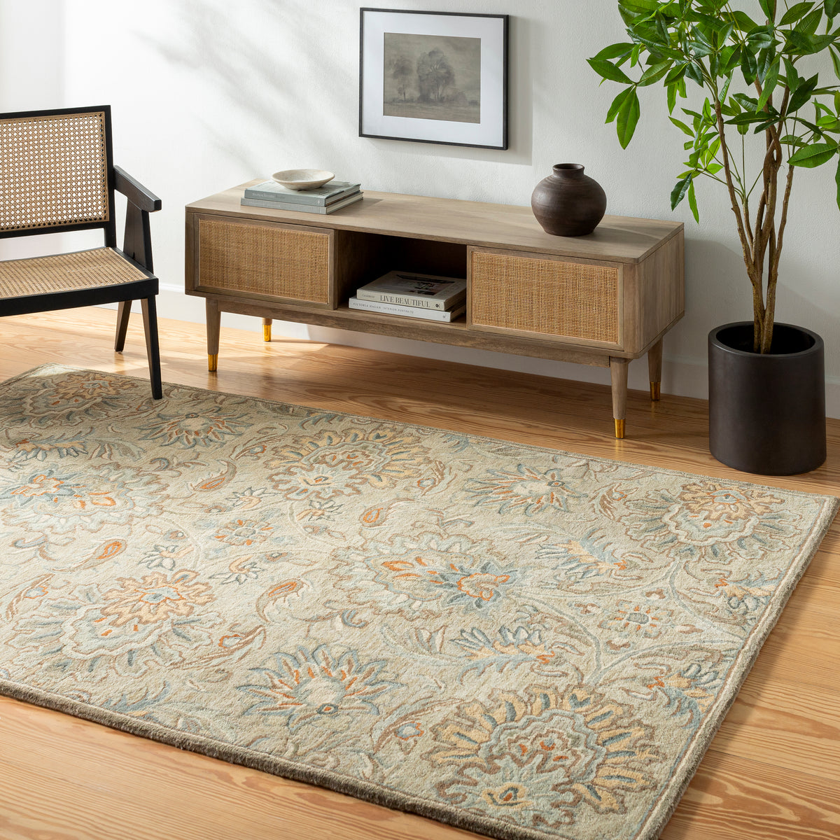 Mediterranean Pewter hand-tufted wool rug with gray, brick red, and slate floral patterns.