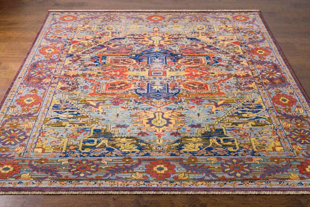 Cappadocia hand-knotted wool rug with vibrant blue, red, and gold Turkish-style patterns.