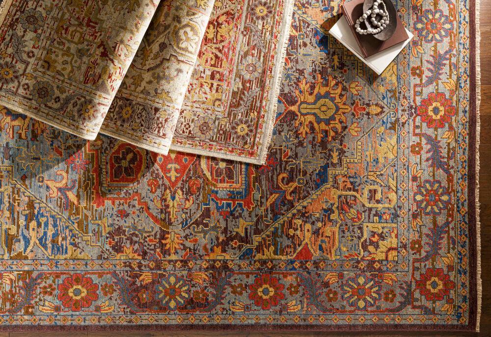Cappadocia hand-knotted wool rug with traditional Turkish design in vibrant blue, red, and gold jewel tones.