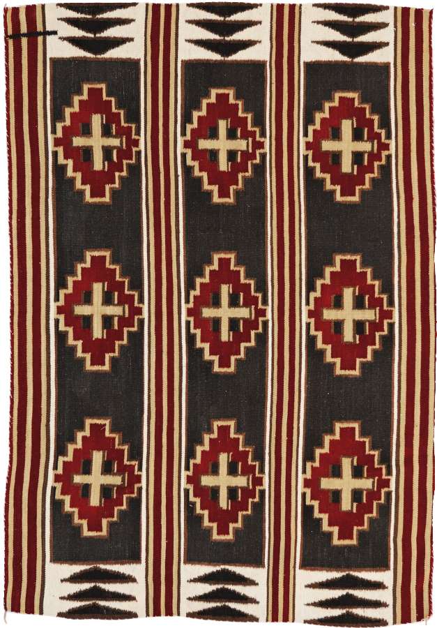 Great Plains Southwest flat weave wool rug with red, black, and cream Navajo-inspired geometric patterns.