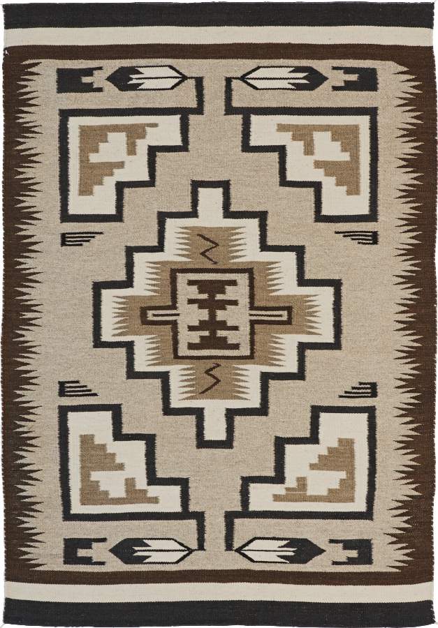 Two Grey Hills wool flat-weave rug with Navajo-inspired geometric patterns in brown, grey, and cream.