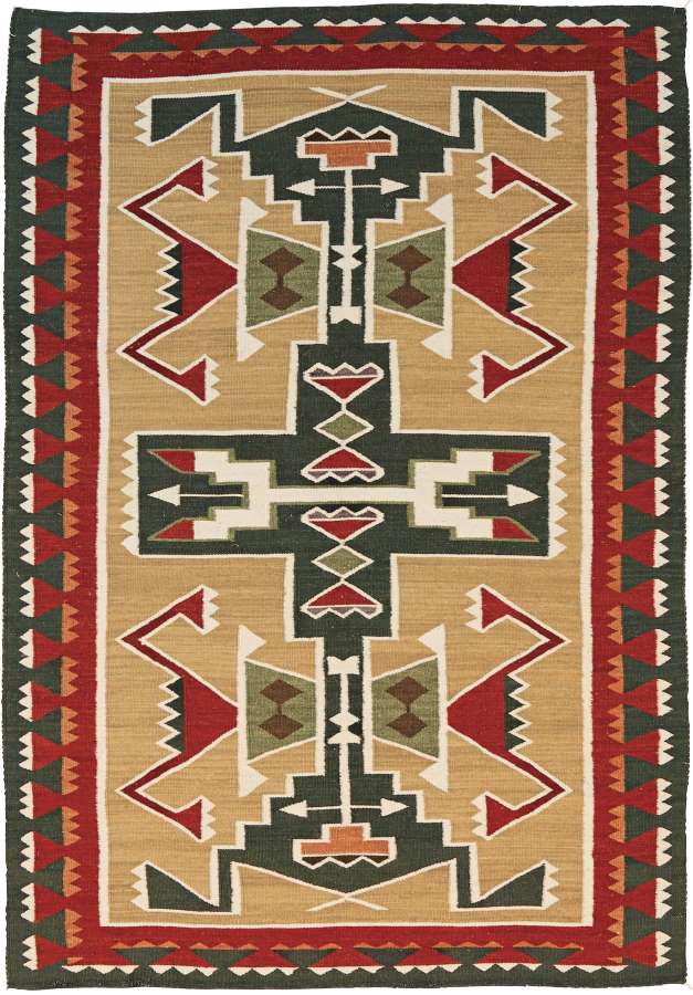 Teec Nos Pos Southwest flat-weave wool rug with geometric Navajo-style patterns in red, green, and beige.