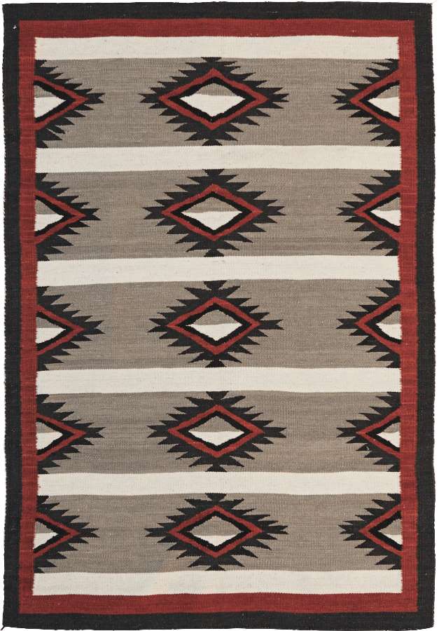 Crystal Southwest flat-weave wool rug with grey, red, and black Navajo-style geometric patterns.